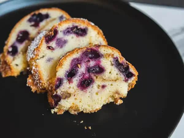 image 14023 - Tea time wouldn't be complete without a slice of coffee cake, and the Best Blueberry Coffee Cake is here to make it the best summertime tea ever! Huge bursts of electric blueberry flavor nestle in the tender, sweet cake, layered with crunchy brown sugar and pecans. Oh yes, the Best Blueberry Coffee Cake will bring out the best for afternoon snacks and beyond!