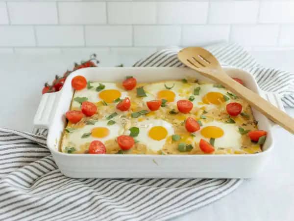 image 14117 - It's going to be a good day! How are we so sure? Because the Good Day Bake is just about to come out of the oven! This grits casserole is tender and packed with poultry flavor and plenty of savory sausage crumbles! But what really makes it sunny are the runny eggs baked right into the casserole, so every slice is essentially self-dipping! With a good amount of cheese to boot, Good Day Bake proves that every day can be great so long as you start off on the right foot... or in this case, the right plate!