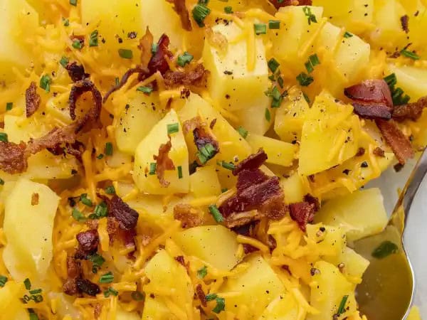 image 14172 - Deconstructed Baked Potatoes cut to the heart of what makes baked potatoes so appealing... and unlike baked potatoes, Deconstructed Baked Potatoes don't require an hour to make them! The potatoes are tender on the inside, crisp on the outside, and topped with rich butter, melty cheese, and crisp bacon crumbles. Top them with sour cream and chives and you'll have the full baked potato experience without the work! Sounds like a sweet (or in this case, savory) deal!