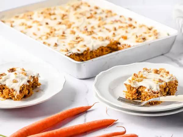 image 14544 - Let's take it back to the good 'ole days! When life gets too serious, a slice of this Vintage Carrot Cake will do ya good. This sweet and moist cake will take you right back to those carefree, child-like times that you yearn for so much. And a spoonful of the rich, creamy vanilla frosting will transport you right back into your momma's kitchen, standing on a chair at the counter, watching her make this cake. Vintage Carrot Cake is the time traveling bite you need to help all of life's adult worries wither away!