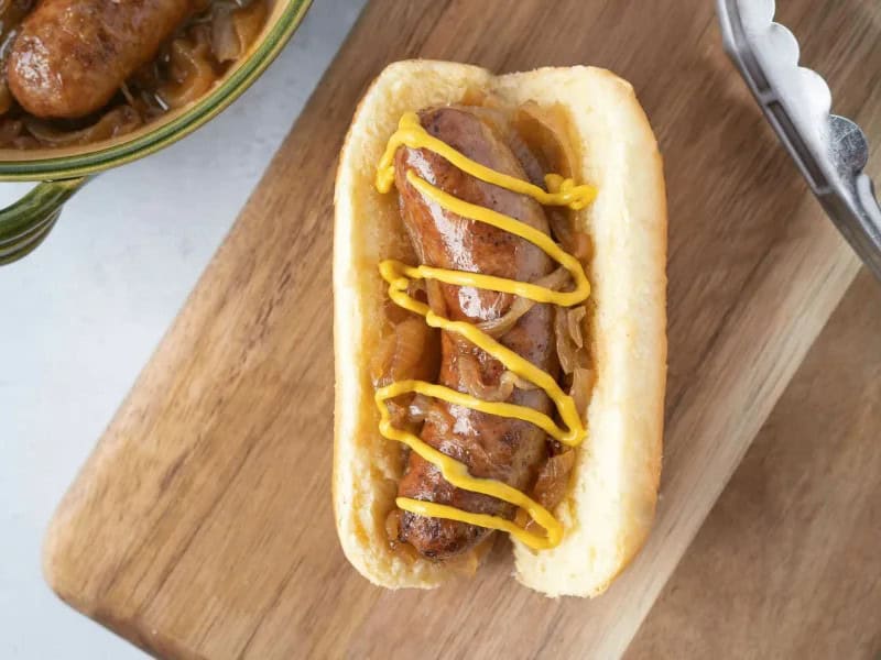 image 14730 - Summer cookouts and barbecues have a few requirements: burgers, chicken, and Beer Brats. Beer Brats grill up savory, spicy sausages and simmer them in sweet and golden caramelized onions and a smoky, hoppy beer sauce. The sausages are coated in extra-savory flavors that are the envy of everyday hot dogs. Beer Brats take a little time and patience to put together, but trust us: everyone at the cookout will be rushing to grab one once they're ready!