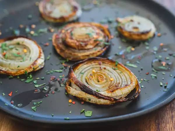 image 14911 - Is there any vegetable that says "scrumptiously savory" like the humble onion? And is there any better way to show your appreciation for said humble vegetable than with a wonderful little trip to the oven? We don't think so! These Roasted Onions put the onion front and center, accenting the flavor with the richness of butter and a little salt. Place Roasted Onions next to steaks, pan-seared chicken, or pork chops and discover just how much they can elevate a dish!