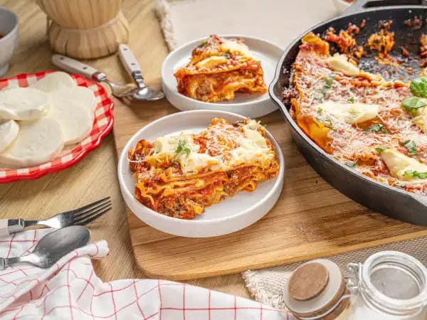 image 15345 - Merry everything! Let's eat! Christmas Lasagna is the perfect answer to feeding your big, hungry, merry revelers and carolers! Lasagna noodles are generously layered with succulent ground beef and Italian sausage slices, plus all the ricotta, parmesan, and mozzarella cheeses you could imagine for an exceptionally festive pasta experience. Invite everyone over for Christmas Lasagna and they will be singing with glee. Merry Christmas (and Happy Holidays!) to all, and to all a good night!