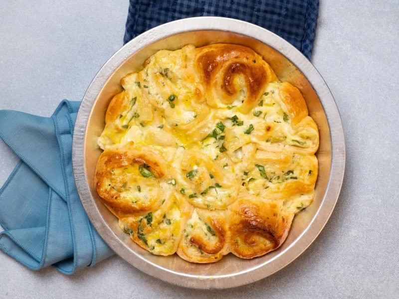 image 15569 - Get ready to indulge in the most scrumptious Cheesy Pinwheels that will make you want more and more! These mouthwatering rolls of goodness are loaded with cheesy yumminess and bring the perfect cheesy combination of fresh spinach and nutty artichoke all rolled up in a crispy puff pastry. Yeah, you'll be running in circles after you taste them! They're just so ding-dang delicious! So, roll on up and grab yourself some Cheesy Pinwheels!