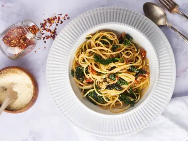 image 15986 - Easy, delicious, elegant... just a few ways to explain this beautiful dish! Sun-Dried Shrimp Pasta is a quick meal packed with loads of great Italian flavors. A creamy tomato-herb sauce is combined with savory sautéed shrimp and tossed with tender spaghetti for an amazing dinner. Add some crusty bread and a glass of your favorite wine and marvel as Sun-Dried Shrimp Pasta makes a terrific date night complete!