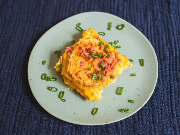image 16099 - After a night full of fluffy robes, singing, dancing, pizza, movies, silly games, and very little sleep, digging into a fulfilling, energizing breakfast as the sun rises is a must. This Sleepover Breakfast Casserole will fill you up with salty ham, fluffy eggs, and melty cheese as you laugh about all the crazy things that happened the night before. Oh, and don't forget the bottom layer of warm and savory English muffins. It's sure to load you up and help you take that nap you're gonna be needing soon since you barely got any shuteye. Sleepover Breakfast Casserole is the ultimate way to end an epic night of partying!