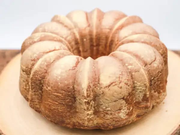 image 16149 - It's amazing that something so seemingly humble could be worth a million bucks. But trust us, once you bite into it, this cake won't seem so humble... in fact, it'll seem like a gold mine! This Million Bucks Pound Cake is literally golden, too. It's a buttery and tender treat that practically sparkles with richness. You can let your tastebuds enjoy the wealth that is the Million Bucks Pound Cake in an instant!
