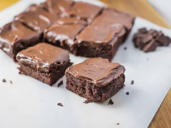 image 16168 - Are desserts your frenemy? Gluten gotcha down? Gluten-Free Fudgy Brownies are just the peace offering you've been looking for. These gooey, fudgy moist brownies are graciously loaded with all the melted, chocolatey flavor you crave without all the gluten your body waves the white flag at. Don't get left out of the dessert loop! These Gluten-Free Fudgy Brownies will get you back in the know!
