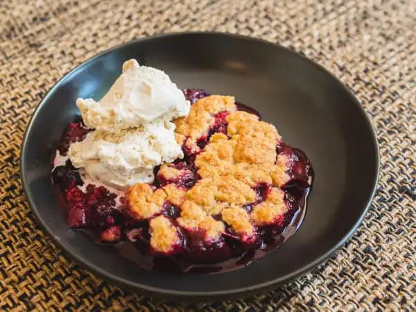 image 16215 - "Yum, yum, yum!" That exclamation is a mandatory requirement after every bite of this Triple Yum Cobbler! It has three kinds of sweet, juicy berries, black, blue, and rasp(berry) for triple the fun. The brown-sugary cinnamon topping combined with a scoop of vanilla ice cream adds even more excitement and brings you the sweetest trio to be! One, two, three... Triple Yum Cobbler is the dessert for you, we know you'll agree!