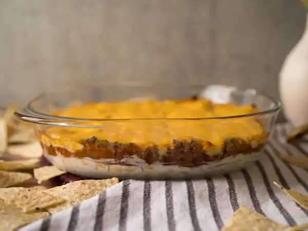 image 16256 - The best times, like a great game, are meant to be shared with good friends and some great food. This Gameday Dip is so tasty, you won't care how the game goes! When the Super-Bowl®-of-dips team consists of a hearty ground beef tight-end, a tangy cream cheese running back, zesty salsa safety, and the all-time leading quarterback melted cheese, you know you've got yourself a winner. So, get in the huddle and get ready to score with this number-one-dip-draft-pick, Gameday Dip! Game on!