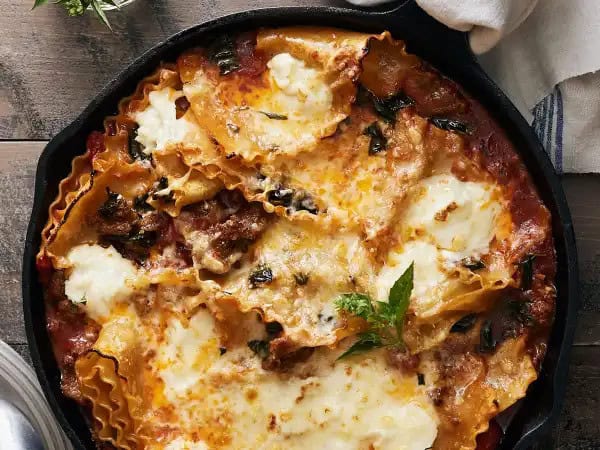 image 16547 - No fiddling. No layering. Just classic lasagna flavors in a single skillet! Oh hey, that means the Sausage Lasagna Bake is no-mess either! That's the beauty of one-dish meals... well, one of the beauties. The other, as anyone who eats Sausage Lasagna Bake can attest, is the savory, spicy flavor! Plenty of pork sausage, bright tomatoes, tender noodles, and lots of melty, creamy, and tangy cheeses just make the most scrumptious sense together! It's a win all around!