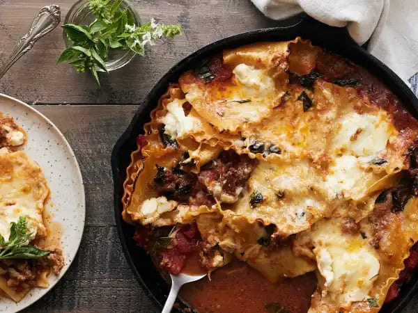 image 16551 - No fiddling. No layering. Just classic lasagna flavors in a single skillet! Oh hey, that means the Sausage Lasagna Bake is no-mess either! That's the beauty of one-dish meals... well, one of the beauties. The other, as anyone who eats Sausage Lasagna Bake can attest, is the savory, spicy flavor! Plenty of pork sausage, bright tomatoes, tender noodles, and lots of melty, creamy, and tangy cheeses just make the most scrumptious sense together! It's a win all around!