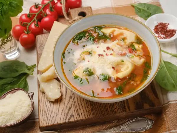 image 16573 - If you're craving something Italian and are feeling the urge to exclaim, "YUM," consider this Italian Yum Soup your oddly specific match! Dip your spoon into a bowl of this savory broth loaded with juicy turkey sausage, cheesy tortellini, and tender veggies and you'll be over-the-moon that your strange hankering brought you here. Sometimes things just work out the way they were supposed to... and it's always pretty tasty and great when those mysterious ways lead you to some Italian Yum Soup! YUM!