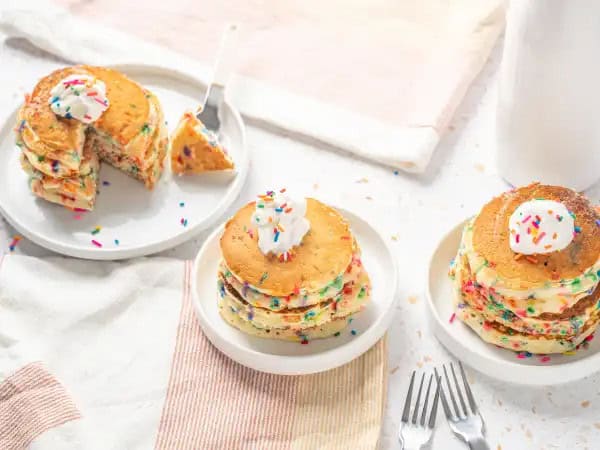 image 16676 - Happy Birthday! We should keep the celebration going all day, dawn 'til dusk! You may have a cake ready and waiting for you in the evening, but you can also have an appropriately festive cake first thing in the morning too! Birthday Pancakes are colorful, cheerful, sweet treats whipped up in an instant and they're ready to help get your birthday celebration started off right! Honestly, these pancakes demand something more than just syrup; they need ice cream or whipped cream, something magical to fit with the day! Fluffy and fun, Birthday Pancakes help make sure you start your special day with a smile!