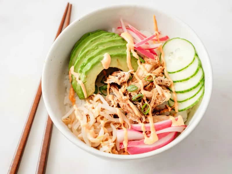 image 16871 - Claiming this is the Perfect Chicken Poke Bowl is a bold claim…a claim backed by the bold, fresh, and enchanting flavors of the dish itself! This poke bowl contains a variety of yummy ingredients like sushi rice, red onion, chicken breast, avocado, and cucumber. It’s topped with spicy mayonnaise for a delicious kick! Skip the hassle and prices of restaurants and make this Perfect Chicken Poke Bowl instead.