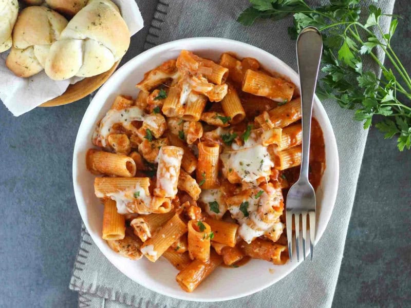 image 16877 - One-Pot Chicken Parmesan Pasta is a real crowd-pleaser! It’s a delicious mixture of tender chicken, hearty pasta, marinara sauce, and creamy, melty cheese. With everything cooked in just one pot, you can achieve amazing flavor AND have a quick clean-up. What more could anyone ask for? One-Pot Chicken Parmesan Pasta is savory, scrumptious, and sure to make your tastebuds happy!