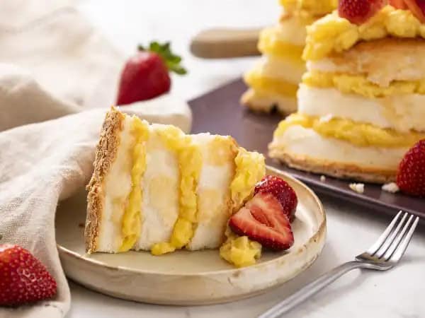 image 169 - Angel Lush Cake takes the beloved angel food cake and decides to make it an even more heavenly experience. The angel food cake is sliced into layers and then filled with a creamy, fluffy, pineapple-vanilla delight! Tropical, floral, and so, so enticing, this filling is better than most frostings! You'd expect Angel Lush Cake to appear in a sunbeam, that's how great it tastes! What a simple sweet treat to amaze your taste buds!