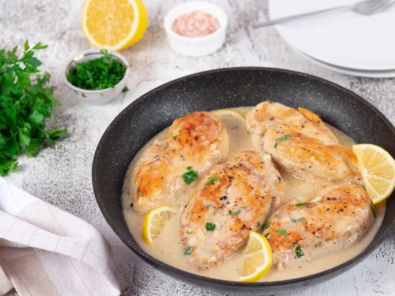 image 16912 - Creamy Lemon Pepper Chicken has, over generations, earned its place as one of the classics of the dinner table. Savory chicken, cooked to a golden brown, flavored with zesty lemon pepper, and draped in a creamy sauce is guaranteed to bewitch anyone who takes a bite. You can serve it over potatoes or rice (which helps to soak up some of that indulgent sauce) or with a crunchy side salad for a bit of refreshment. It's time to go back to the classics with Creamy Lemon Pepper Chicken.