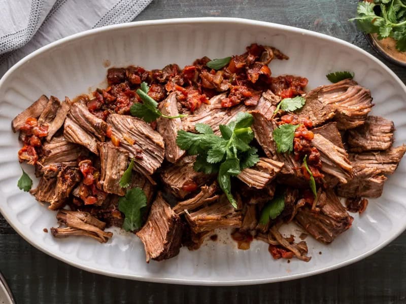 image 16920 - If you're hoping to host a Taco Tuesday or have the gang over for a Tex-Mex feast, Mexican Pot Roast is the easiest, most delicious way to make that happen! It's as simple as only needing two ingredients: tender beef chuck roast and tangy salsa, and dumping them into a slow cooker to do all the work. Sounds pretty great, huh? Enjoy it on tacos, salads, quesadillas, you name it! Mexican Pot Roast literally brings the fiesta to you!