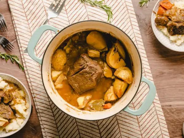 image 17416 - You don't have to be from the South to enjoy this Roast Beef Supper. With a beefy chuck roast packed with yellow onions, fragrant garlic, bright carrots, earthy cremini mushrooms, and fluffy Yukon Gold potatoes, all seasoned and roasted until fork-tender, you will quickly take a seat at the table for this one! Everyone is invited to enjoy this Roast Beef Supper any time your soul calls for a little Southern hospitality. Come on y'all, it's supper time!