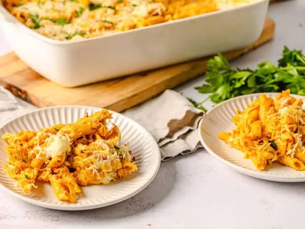 image 17994 - Fall Classic Pasta Bake flips the script completely. There's no tomato sauce to be found here. Instead, pumpkin takes its place, ensuring the sweet, rich, and herbaceous sauce has the warmth and glory of autumn in each drop. The tender pasta, the succulent bacon, and the savory chicken breasts all add more dimension and heartiness to the Fall Classic Pasta Bake, but it's the distinct pumpkin sauce that you'll remember most of all. And for good reason!
