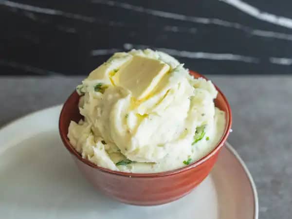 image 18175 - Once you taste these Creamy Whipped Parsnips, you might never want to eat average, old mashed potatoes again! The sweetness and nuttiness of this underrated root veggie pairs perfectly with the savory notes from the russet potato, and of course, all the creamy, buttery additives you include in its classic Southern cousin... but trust us, this combo is even better. Whipped to fluffy yumminess, these Creamy Whipped Parsnips might actually show up at your table a lot more than you imagined they would!