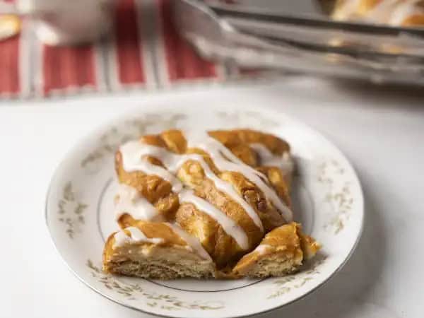 image 18270 - Fall in love with a dessert everyone excitedly waits all year to enjoy! What happens when you take some refrigerated cinnamon rolls, pumpkin purée, and cream cheese, and combine them? Well, Pumpkin Pie Bubble-Up Bake, of course; just the best seasonal treat that's both easy to make and incredibly delicious. Pumpkin Pie Bubble-Up Bake has the warmth of cinnamon sugar, the creamy richness of cream cheese, and the spiced seasonal delight of pumpkin... who could say no to that?