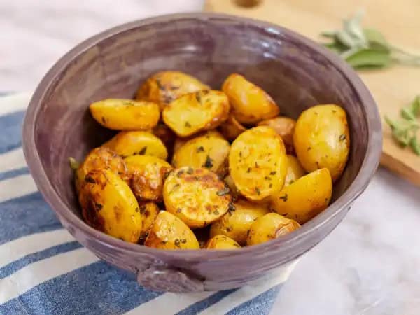 image 18332 - If you love potatoes like we do, you can never have too many great recipes on your potato recipe list! Best Oven Baby Potatoes will quickly find its way to the top of your faves in just one sitting. Loved by basically everyone, these baby potatoes are generously seasoned and then roasted to fork-tender perfection. Served with steak, chicken, or pork, Best Oven Baby Potatoes are a friendly companion to all. It's always great to find new flavor friends!