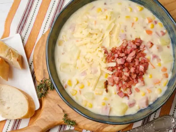 image 18587 - Great chowder in an hour isn't impossible; in fact, it's deliciously achievable with this Quick & Easy Cheesy Ham Chowder! The broth is creamy and savory, and filled with succulent ham and crisp bits of bacon for an extra pork kick! Loaded with cheese, potatoes, and sweet summer corn, the Quick & Easy Cheesy Ham Chowder is a warm weather favorite that tastes bountiful and looks beautiful!