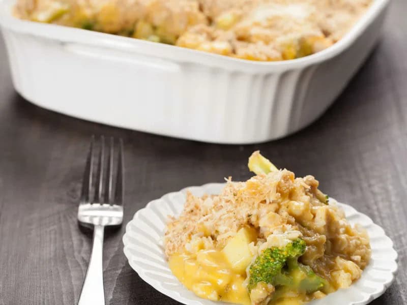 image 18815 - Chicken Divan is a simple chicken meal for any night of the week! This casserole is packed with flavors like tender cooked chicken, melted cheddar cheese, and rich and creamy soup. It’s perfectly seasoned with garlic powder and onion powder, and topped with crunchy panko bread crumbs. Chicken Divan makes for a delicious meal—it’s hearty, rich, and savory—and can be made in a flash!