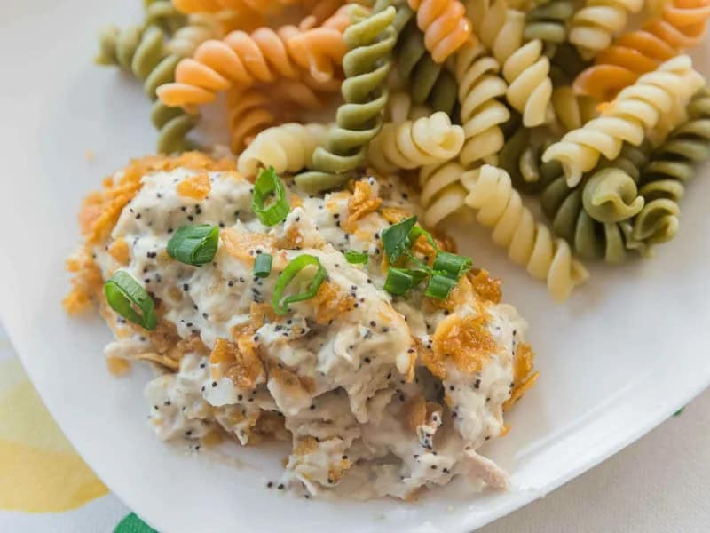 image 18940 - Poppy Seed Chicken raises the casserole chicken game to a brand new level, and your taste buds are invited! The savory chicken is accented by the aromatic and nutty poppy seeds and made extra delectable by the buttery cracker crust. Add in a rich, creamy sauce infused with meaty flavors, and you have a new favorite! Poppy Seed Chicken is perfect for adding to, and breaking up, your weeknight routines because it shakes everything up with its amazing flavors!
