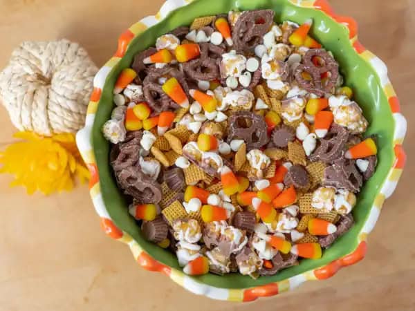 image 19175 - When the air turns crisp, it churns up some excitement for all the holiday gatherings that are to come. And with any good gathering comes good snacks, and Fall Snack Mix is the perfect way to treat your guests! When you combine the already irresistible Chex Mix™ with tempting Reese's® Mini Peanut Butter Cups, the highly anticipated Brach's