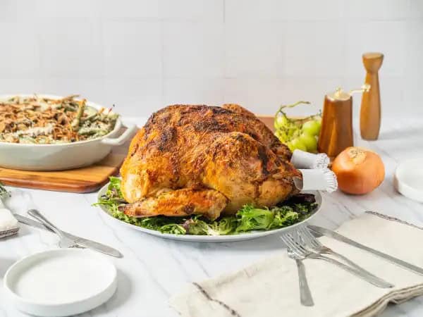 image 19193 - Does baking a turkey intimidate you? With Mayo-Roasted Turkey, you will get a moist, flavorful bird every time! From the spicy mayonnaise mixture smoothly spread all over the turkey to the fresh herbs, garlic, and bay leaves tucked inside, and last but not least, the way it's baked until golden-brown, this turkey has so much going for it... inside and out! Mayo-Roasted Turkey features less basting, but more flavor tasting. Don't ever be scared by this Thanksgiving favorite again. This bird's got you covered!