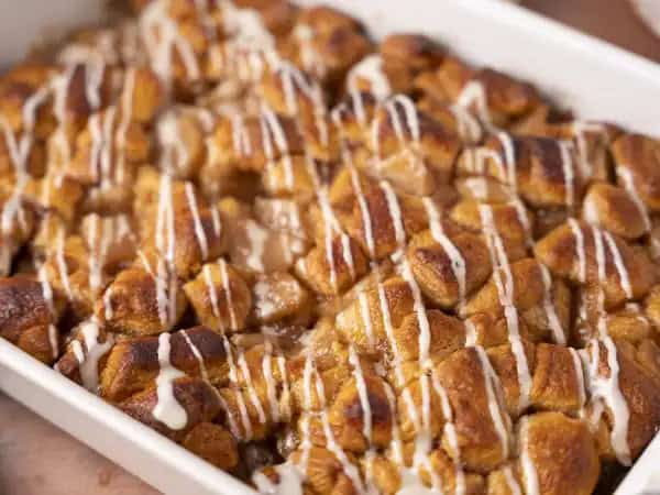 image 19778 - Mmmm, there is nothing like walking away from the donut shop with a warm apple fritter in your hands, except maybe cutting into this Apple Fritter Casserole. Jammy apples and tender cinnamon roll crust, with the warmth of the spice enhancing the smoky sweetness of brown sugar and the richness of butter... mmmm! Well, it had to be said again! Apple Fritter Casserole can be served for breakfast or dessert, and it's equally loved as either!