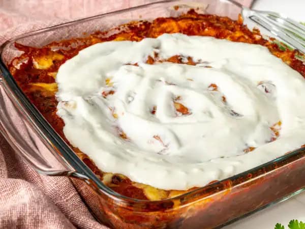 image 19994 - Bean Burrito Bake aims to create a burrito experience that everyone can, and will, enjoy! Each layer is filled with tender tortillas, hearty, savory beans, and creamy Monterey Jack cheese, with all the vibrancy and spice you want from a great Tex-Mex dish. This Bean Burrito Bake will have you jumping up and down for more!