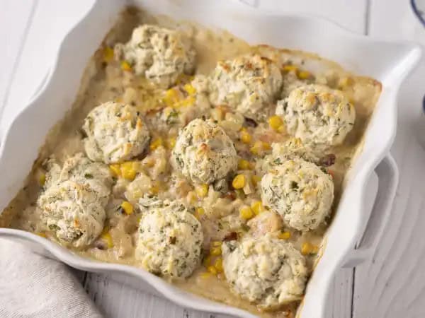 image 20959 - Think of Chowder Biscuit Bake like this... it has everything you love about a warm and gooey chicken pot pie, like the rich and creamy roux, the juicy veggies, and the mouthwateringly savory flavors. It just swaps the chicken for some pink, plump shrimp and trades the boring crust for some fluffy, herb-seasoned biscuits. That's a pretty fair deal, huh? It's pretty magnificent, really. Switch up your comfy and cozy a little bit with this Chowder Biscuit Bake! You'll be glad you did!