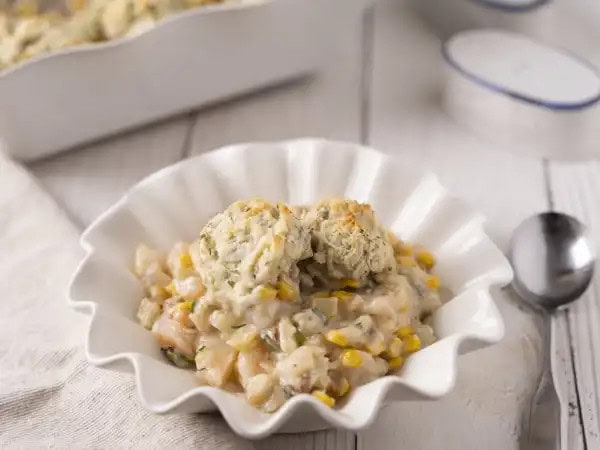 image 20963 - Think of Chowder Biscuit Bake like this... it has everything you love about a warm and gooey chicken pot pie, like the rich and creamy roux, the juicy veggies, and the mouthwateringly savory flavors. It just swaps the chicken for some pink, plump shrimp and trades the boring crust for some fluffy, herb-seasoned biscuits. That's a pretty fair deal, huh? It's pretty magnificent, really. Switch up your comfy and cozy a little bit with this Chowder Biscuit Bake! You'll be glad you did!