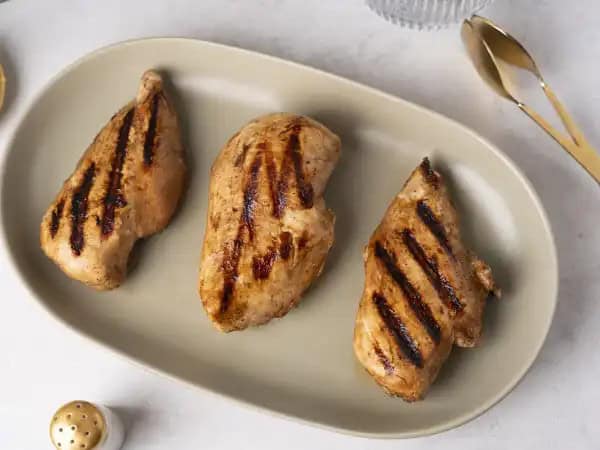 image 21162 - No one likes dry, tasteless chicken. You'll never have that problem again with this Perfect Grilled Chicken Marinade! It takes your favorite protein and elevates it to the optimal level of moist, tender goodness by covering it with a sweet, savory sauce that will make every bite more and more memorable. Whether you serve it next to veggies, put it between a bun, or plop it on a salad, your meal will be even better when this Perfect Grilled Chicken Marinade is a part of it!