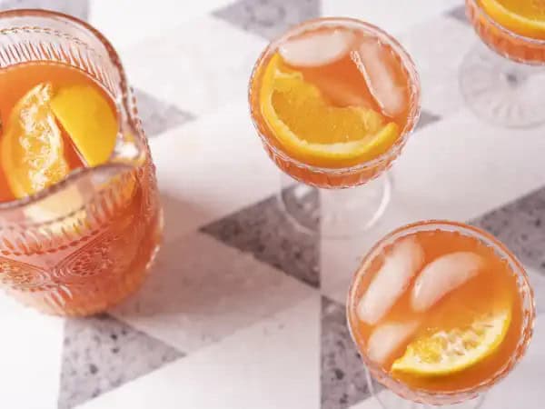 image 21176 - If your workday passed like molasses and you are looking for something tall and strong to make up for it, well, you know what time it is! An ice-cold glass of Rum Punch will make you feel like you're on a tropical vacation with the first sip. This bright-colored, sweet, fruity concoction will make your worries sail away as you enjoy some fun in the (metaphorical) sun. Pour yourself some of this Best Rum Punch and you'll understand what all those beachy songs are talking about! Cheers to that!