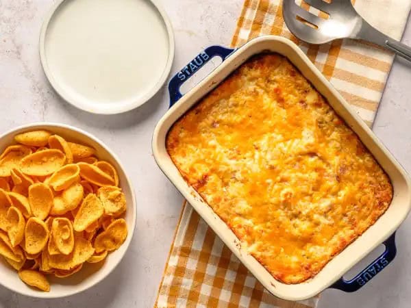 image 21482 - Get ready to dip and dive into some excellent game-day flavors! Game Day Crack Dip is such a simple and easy snack to make, you'll be shocked that you haven't had it before! Creamy, tangy, zesty sauce smothering succulent bacon and savory chicken, with plenty of melted cheese! Chips may not be enough for Game Day Crack Dip; you might need toast and veggies, or maybe just spoons. You won't want to waste a single drop of this dip. It's a victory lap in a bowl!