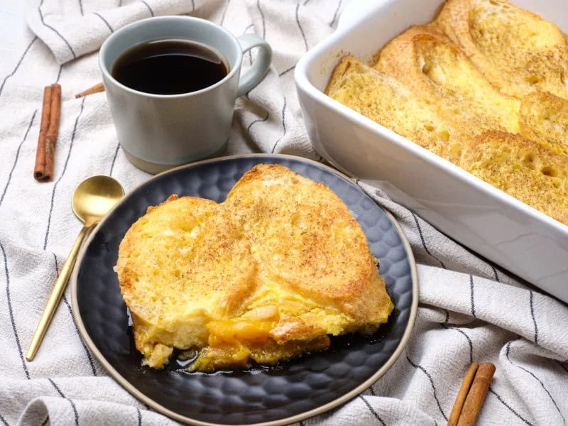 image 21955 - We don't know about you, but we're feeling peachy keen to whip up some Peachy-Keen French Toast! Floral, juicy peaches in a smoky, sweet brown sugar sauce, topped with thick bread soaked in a creamy custard and baked to a golden-brown. No wonder everyone who tries it is eager for more! Peachy-Keen French Toast is how you wake up in the morning in style: with a bake that makes the whole day beautiful and sunny from minute one!