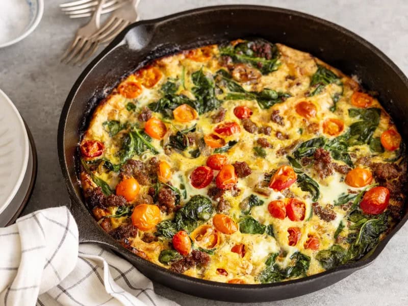 image 22091 - Great taste is what you get when you dig into All I've Got Frittata. This crustless quiche suspends savory, spiced sausage, bright tomatoes, and refreshing spinach in hearty, fluffy eggs. It's basically all you've got because this dish is all the tasty stuff you can find in your fridge all together! Mmmm, if all you've got is All I've Got Frittata, then you're in a pretty good place to start the day!