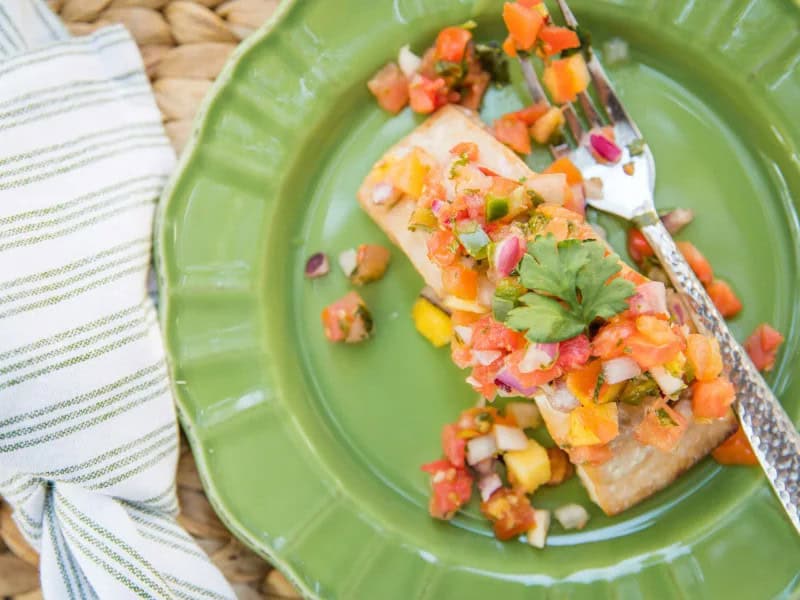 image 2275 - With a little twist to the traditional menu, your holiday dinner can become positively tropical! Island-Style Baked Mahi takes the sweet, mild flavors of mahi-mahi and accents them with a nutty, fruity wine marinade. Made extra fatty and satisfying with mayo and butter, this tender fish literally melts in your mouth. Island-Style Baked Mahi can serve as a unique holiday main course or as a favorite weekday dinner, and elicit the same excited reaction for both occasions!