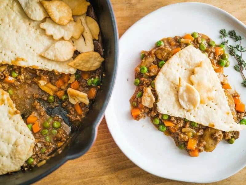 image 2703 - Even when you only have 30 minutes to make dinner, that's not a reason to forgo your craving for pot pie! Skillet Beef Pot Pie is a speedy solution when you need a flaky, buttery crust over a rich, savory, meaty mixture of beef, mushrooms, and veggies. Herbaceous, hearty, and wholesome, Skillet Beef Pot Pie is home cooking taken to the next level. This is exactly the kind of meal you'll want to eat right out of the skillet!