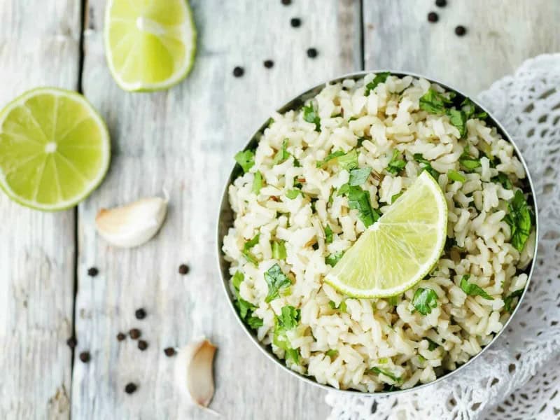 image 2967 - No trip to Chipotle® would be complete without loading your burrito with their delicious cilantro lime rice. Now you can enjoy that same fantastic food foundation without having to leave your kitchen! Copycat Cilantro Lime Rice has the same fluffy, hearty texture perfect for soaking up tender seasoned meats and beans, with the same herbaceous and citrus tart flavor. Best of all, Copycat Cilantro Lime Rice takes less than half an hour to make, so you can actually save time by making this fresh in your own home. Taco night just got all the more tantalizing!