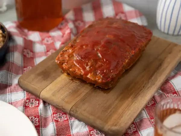 image 4579 - There are no bells or whistles needed to whip up this Easy Meatloaf, but never fear! All the hearty, warm, and juicy flavors still bring every ounce of excitement with every bite, without too much work to achieve it... and we love it when that happens. If you're craving the sweet and savory classic, this version is the way to go. Save yourself some time without sacrificing the goods with this Easy Meatloaf! You'll be happy you tried it!