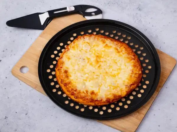 image 5 - Be prepared to be amazed! This Amazing White Pizza is unlike any other you have tasted or seen before! Packing a personal-sized punch, this crispy crust gets layered with some rich garlic oil, a whole lot of melty mozzarella cheese, and a sprinkle of herby Italian seasoning to create a pizza every person will appreciate! Leave the red sauce in the pantry and get ready to be in awe with this Amazing White Pizza. It's simple yet oh-so decadent!