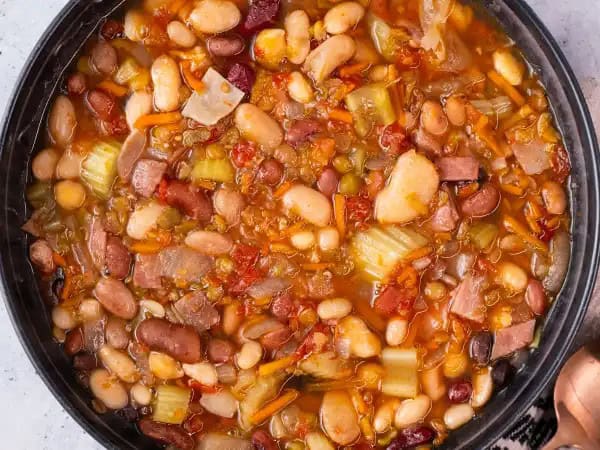 image 5325 - We've tried to keep this a secret for a long time, but we just can't hold it in any longer. So, here we go... here's Spill-The-Beans Soup! Known in our family for its savoriness and its absurd amount of beans, it's one of the recipes we consider a classic. The one catch is that you have to plan a little, because you have to let the bean-y goodness soak for a few hours in the slow cooker. But believe us, it's worth the wait and literally so easy! Phew, it feels good to finally get that off our chest. It's no secret no more just how delicious Spill-The-Beans Soup is!