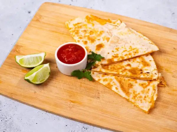image 5330 - When you're not in the mood to cook or you don't have a ton of groceries on hand, it's the perfect time for these Easy Cheesy Quesadillas! This recipe technically only calls for three ingredients, but that doesn't mean it's not tasty. Truly no fancy-shmancy dish can ever outshine the perfection that is a toasty tortilla filled with some melty, gooey cheese. It gets even better with the bonus ingredients you decide to add on top. Mmm, Easy Cheesy Quesadillas are a real winner every time hunger strikes!