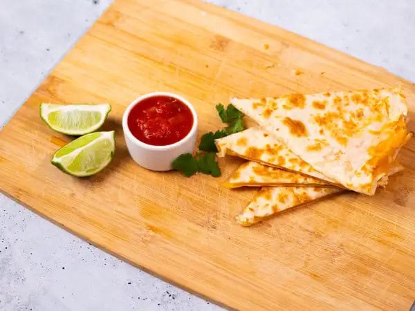 image 5339 - When you're not in the mood to cook or you don't have a ton of groceries on hand, it's the perfect time for these Easy Cheesy Quesadillas! This recipe technically only calls for three ingredients, but that doesn't mean it's not tasty. Truly no fancy-shmancy dish can ever outshine the perfection that is a toasty tortilla filled with some melty, gooey cheese. It gets even better with the bonus ingredients you decide to add on top. Mmm, Easy Cheesy Quesadillas are a real winner every time hunger strikes!